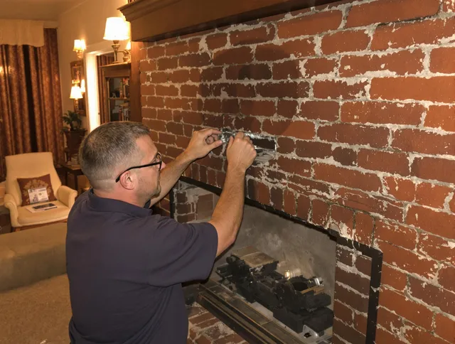 Pataskala Chimney Sweep expert fixing a fireplace in Pataskala, OH